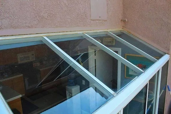 The same glass canopy after cleaning, with a clearer view through the glass