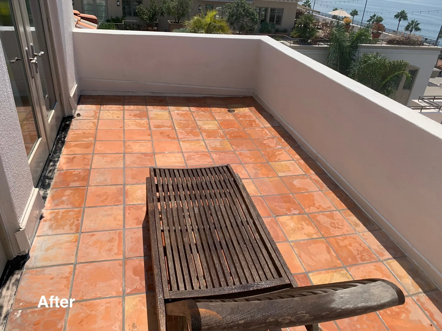The same tiled patio and surrounding walls after PCS cleaning